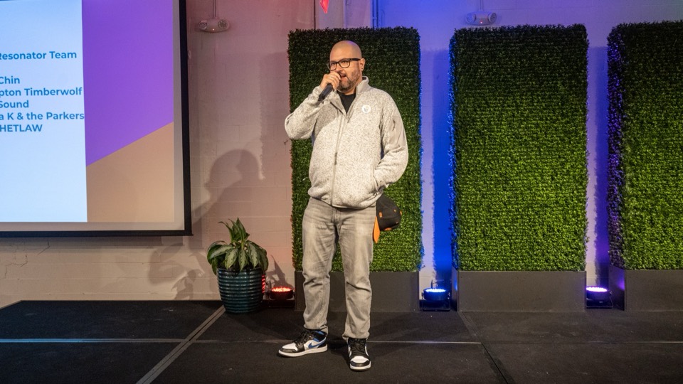 Eddie Garcia speaking onstage with a microphone.
